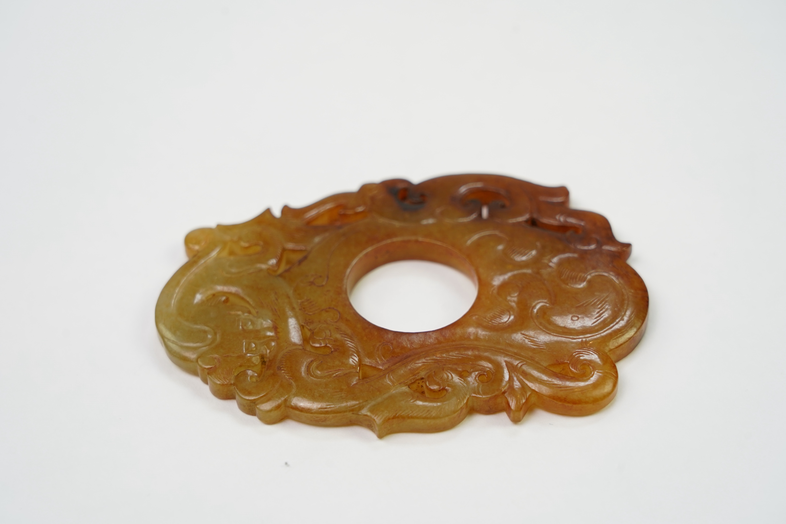 A Chinese archaistic jade plectrum-shaped plaque